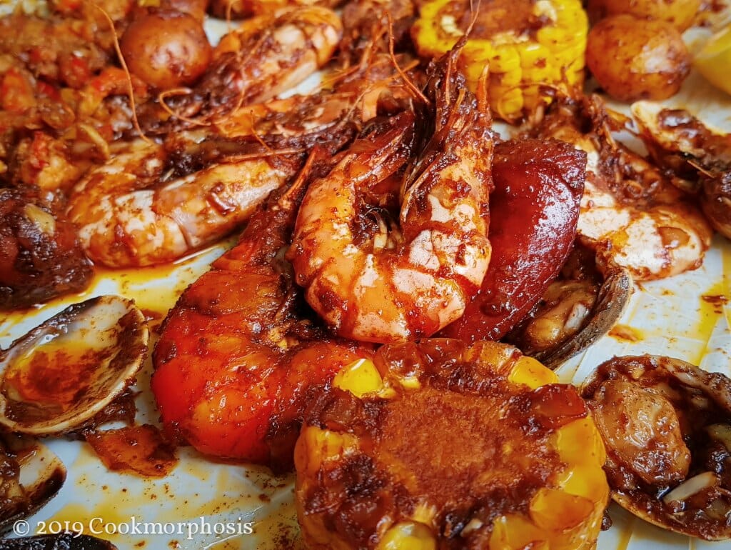 a close up of a shrimp and sausage made with cajun sauce and seasoning mix