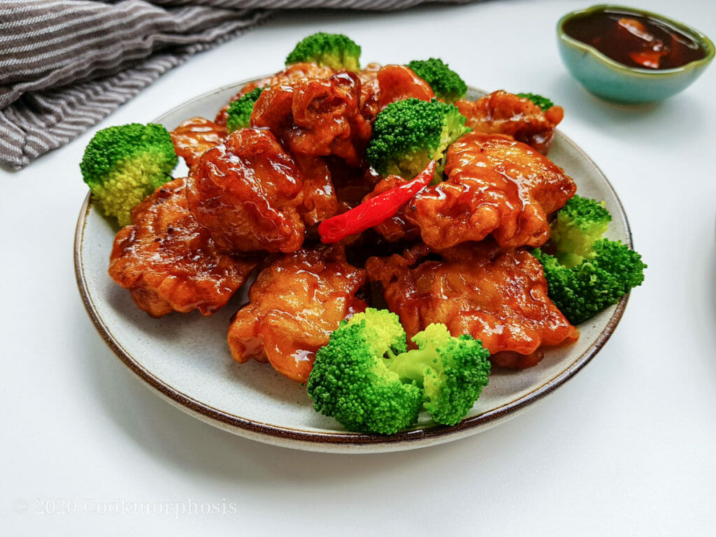 general tso chicken with steamed broccoli and whole fresh chili