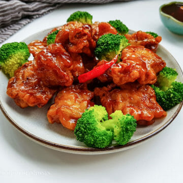 general tso chicken with steamed broccoli and whole fresh chili