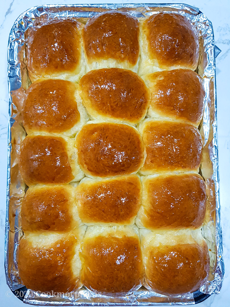 dinner rolls topped with honey and egg wash