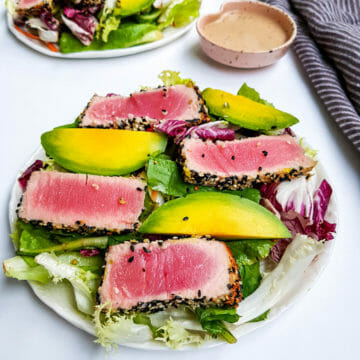 sesame crusted pan seared tuna salad with fresh avocado and vegan ginger dressing