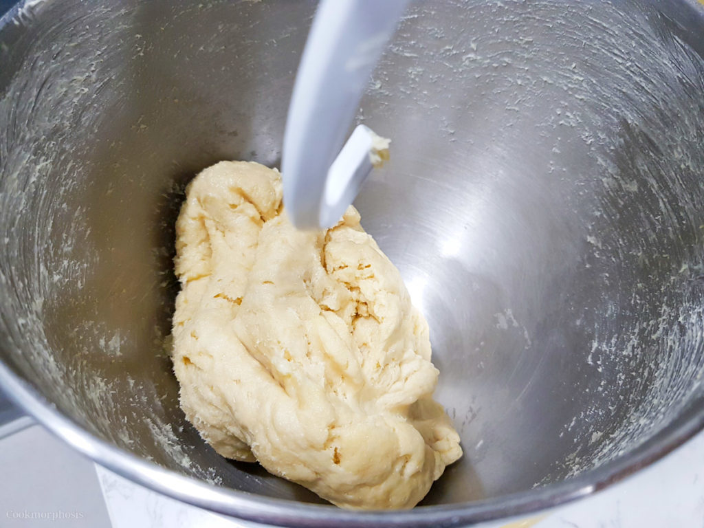 easy milk bread rolls dough starts pulling from the sides of the bowl