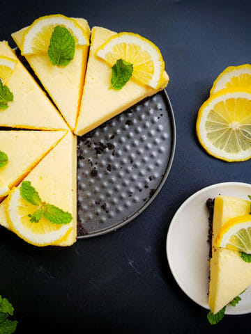 no-bake lemon chiffon cake recipe garnished with fresh lemon and mint leaves