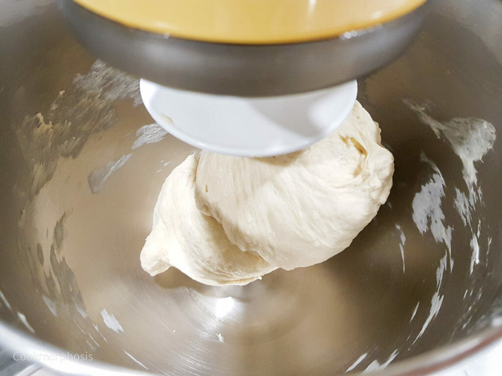 the dough starts pulling completely from the sides of mixing bowl