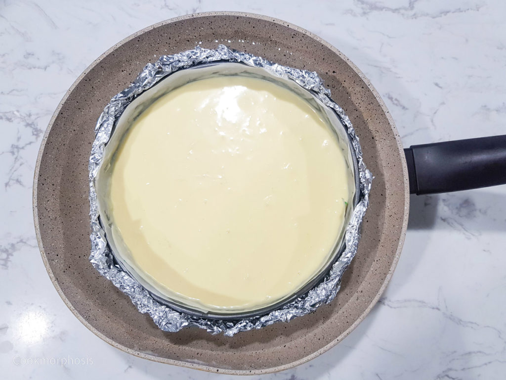 the whole pan of cheesecake batter was double wrapped in foil then put inside a water bath ready for baking