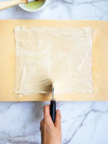 cut phyllo dough into small squares to make this birthday party appetizer