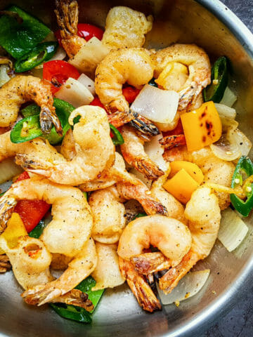 Chinese salt and pepper shrimp sauteed with bell peppers, white onion, and jalapeno