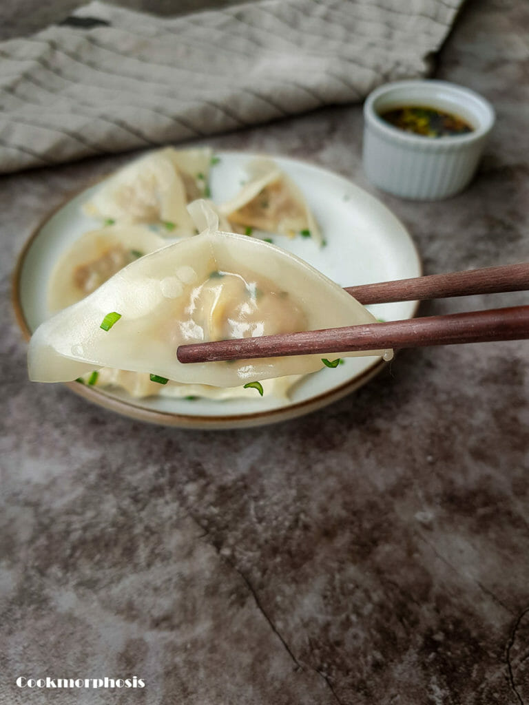 steamed pork and chive or pork and prawn dumplings garnished with chopped fresh chives.