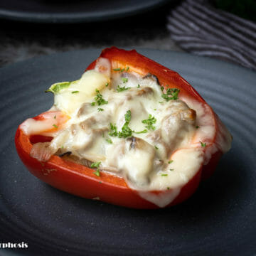 Cajun cheesesteak stuffed peppers put on a grey plate, a 30 minutes ready recipe