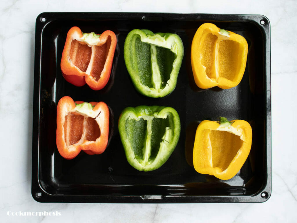 6 halves of bell peppers are put in a baking pan