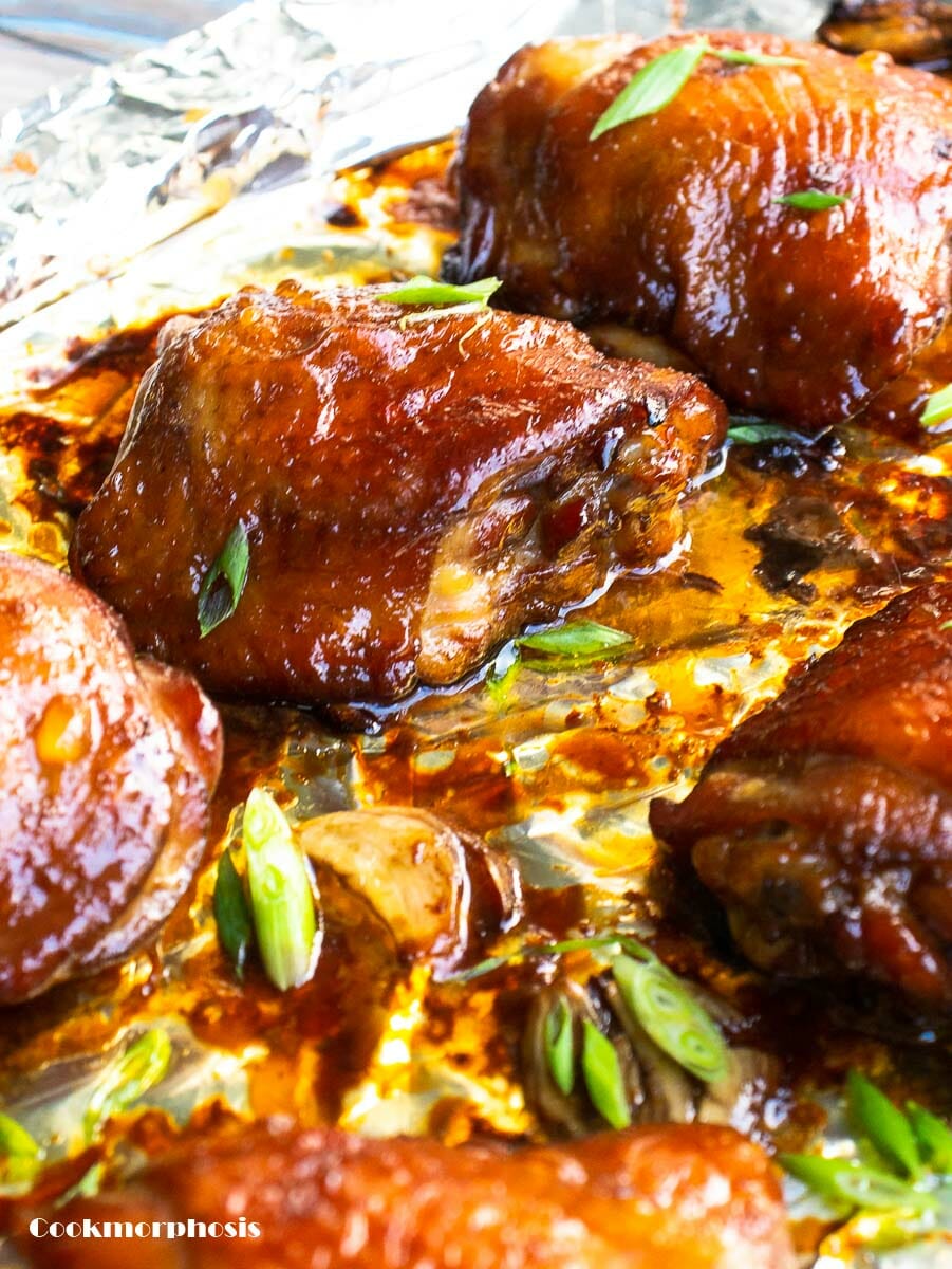 baked soy sauce chicken thighs garnished with chopped green onions