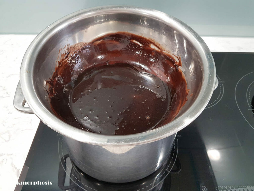 making chocolate ganache for chocolate pandan panna cotta