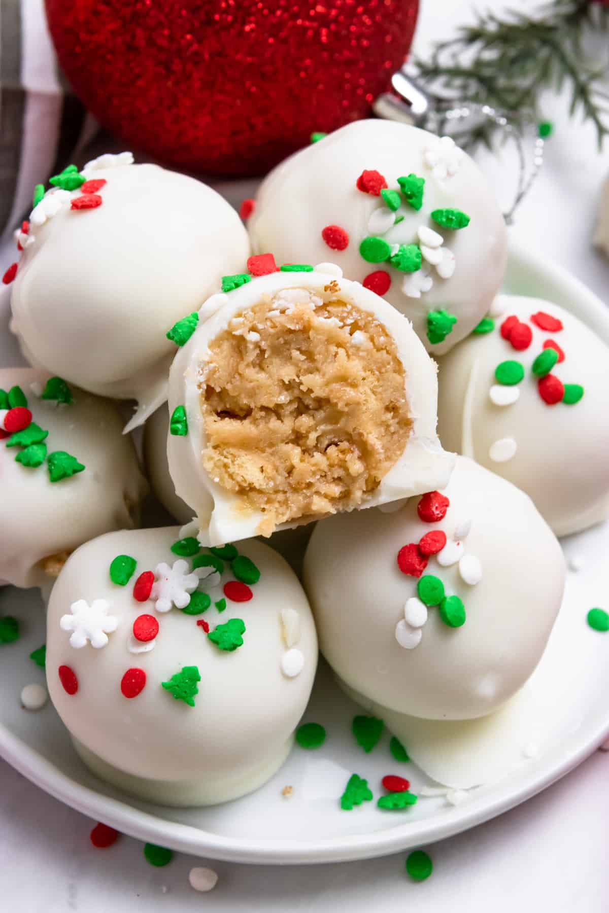 7 christmas oreo balls topped with sprinkle