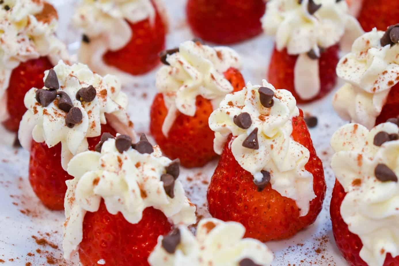 strawberries filled with cannoli cream and topped with choco chips