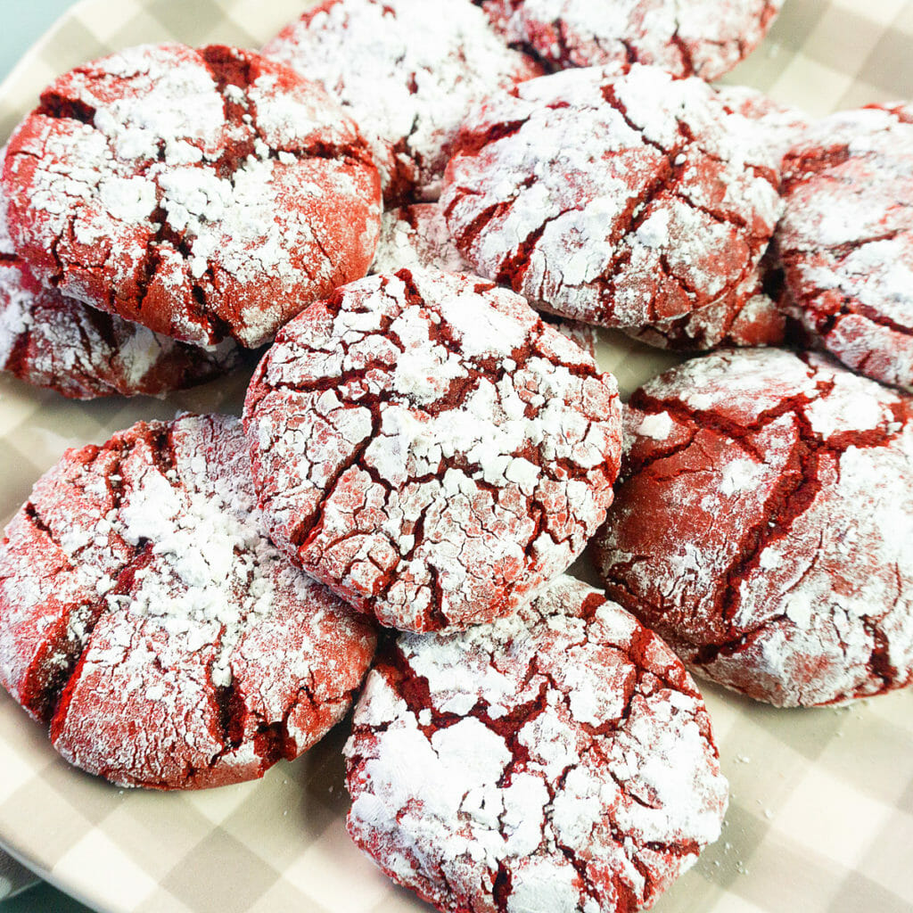 a plate of red velvet crinkle cookies