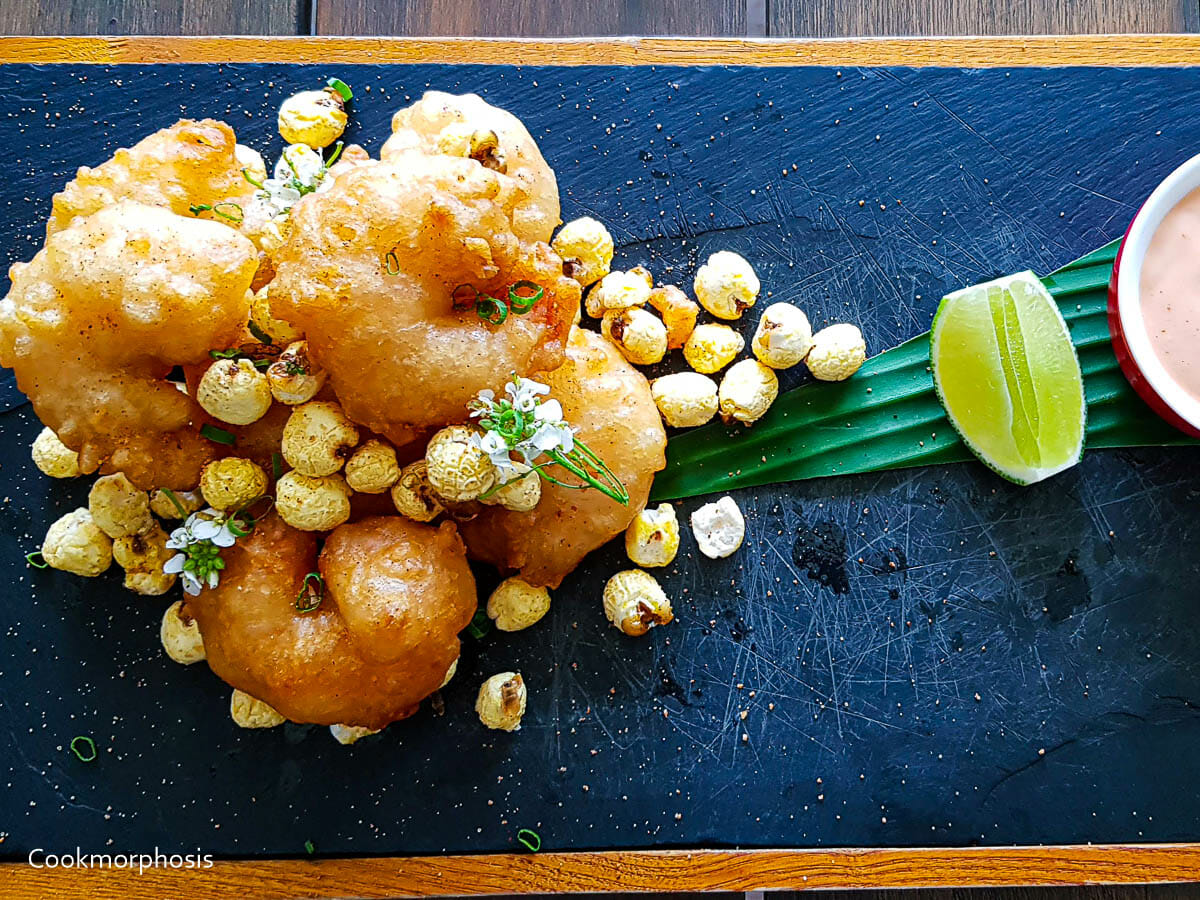 easy crispy popcorn shrimp serve with wedge of lime and creamy spicy mayo sauce