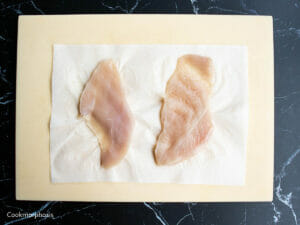 2 pieces of chicken breast were gently pounded by a meat mallet into half inch of thickness