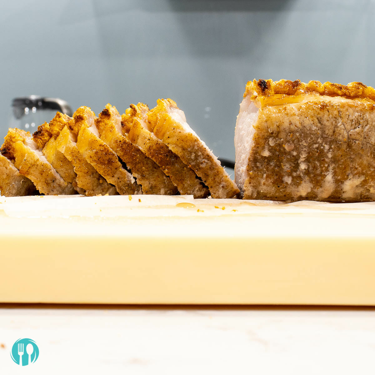 a block of crispy pork belly cut into slices