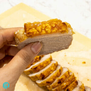 a slice of golden, crispy, Chinese style pork belly