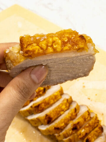 a slice of golden, crispy, Chinese style pork belly