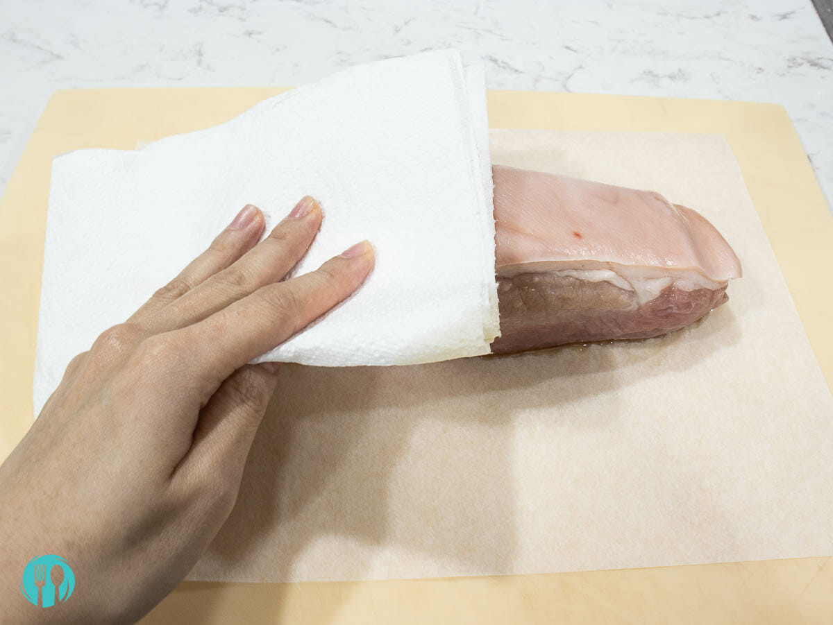 clean pork belly with a paper towel