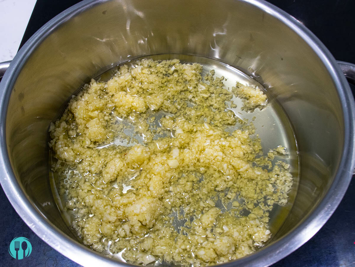 garlic and oil are added into a sauce pan over medium heat