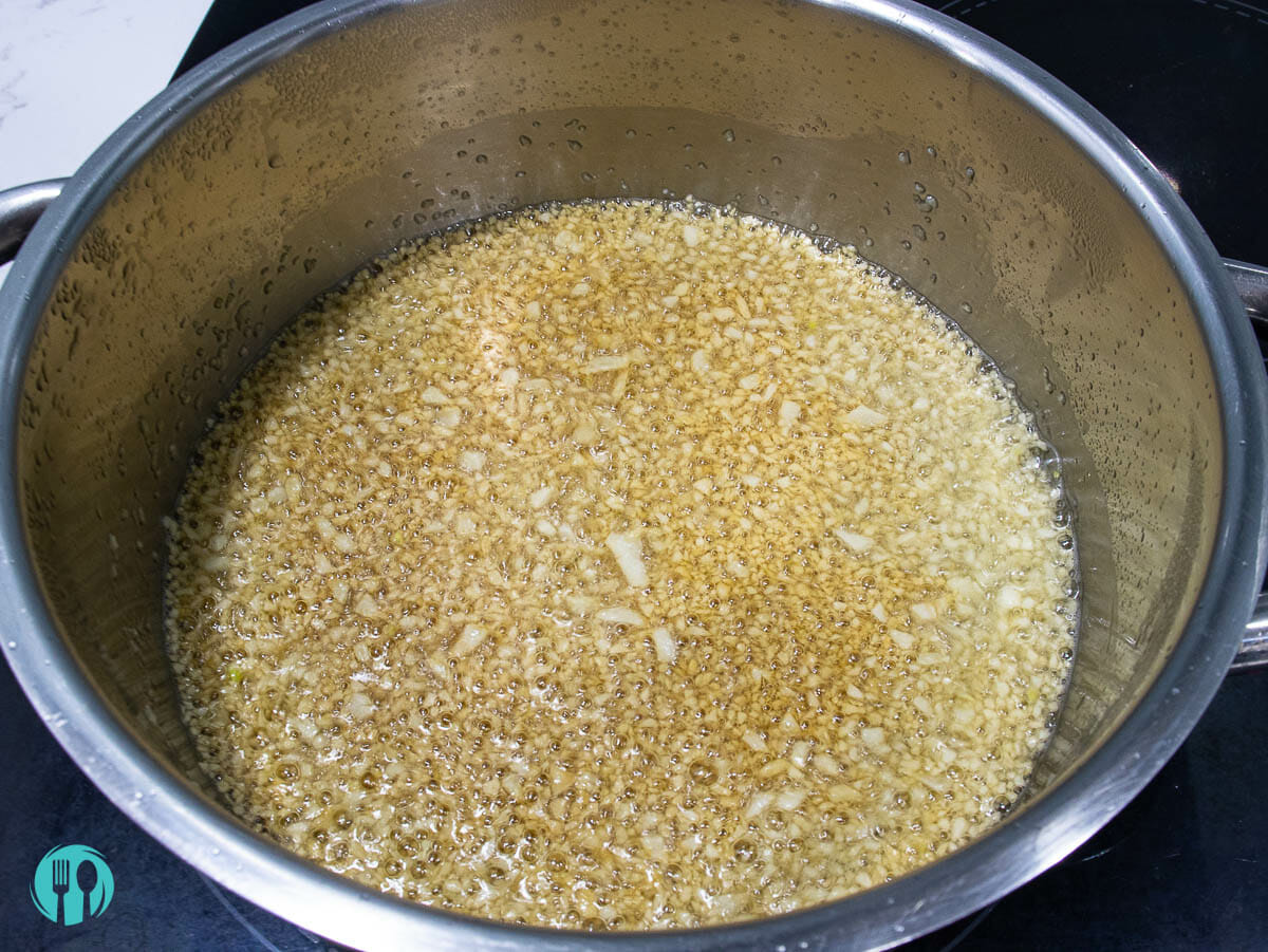 fried garlic turned golden brown in a hot oil pot