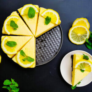 6 slices of lemon chiffon sponge cake topped with lemon slices and mint leaves
