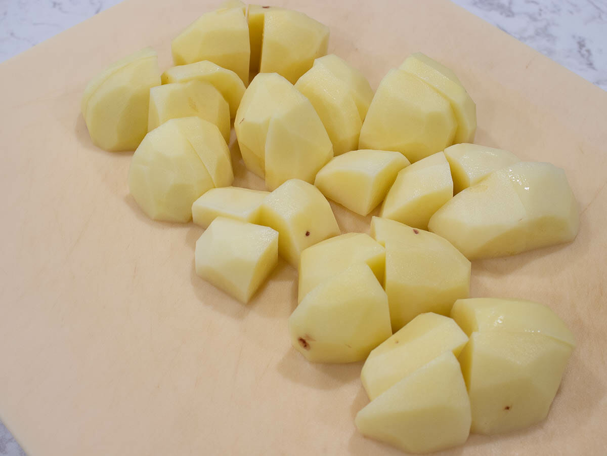 potatoes are cut into many uniform-sized pieces