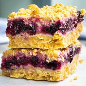 2 easiest blueberry crumble bars stacked on each others
