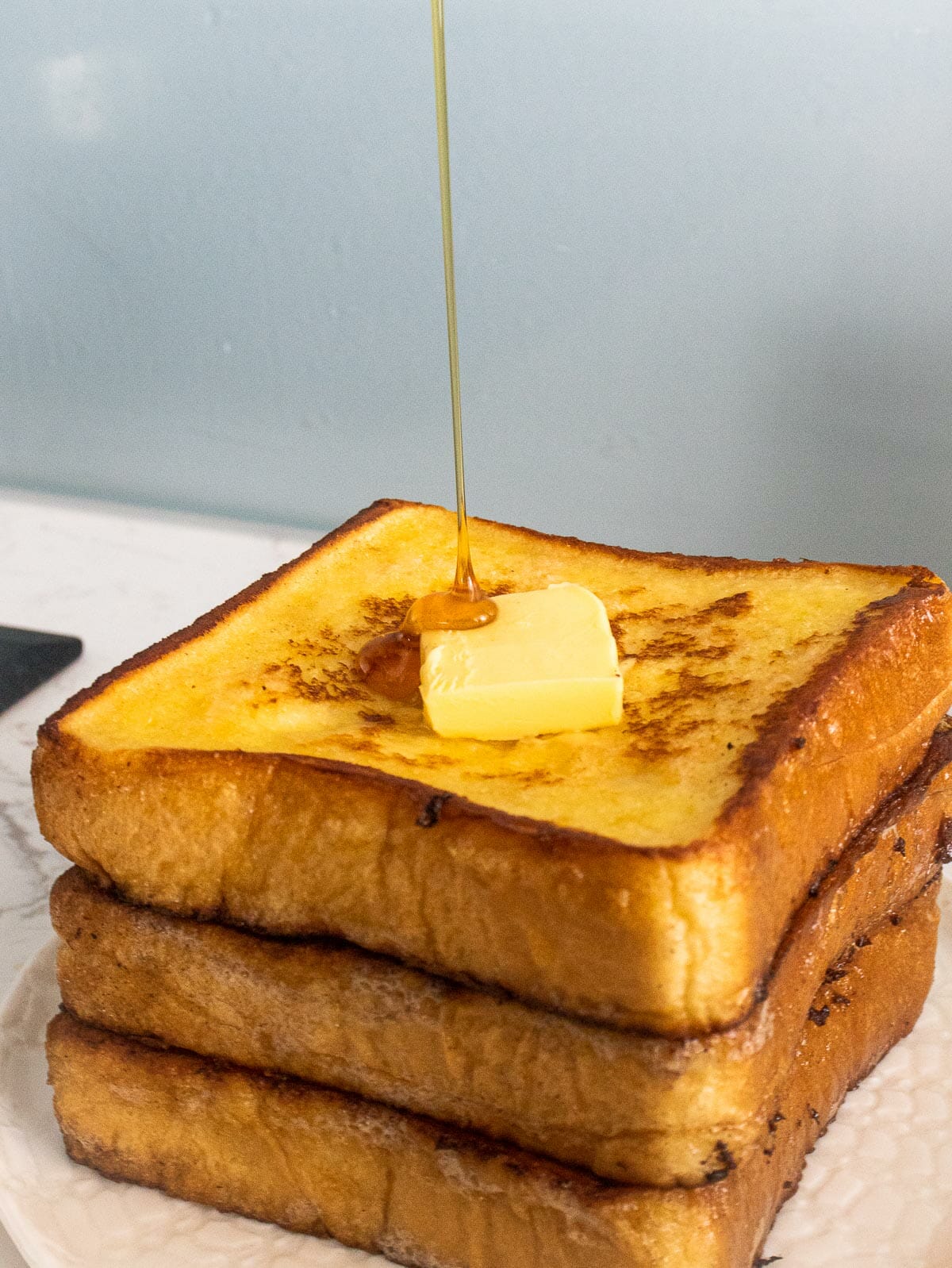 drizzle honey over a stack of French toast