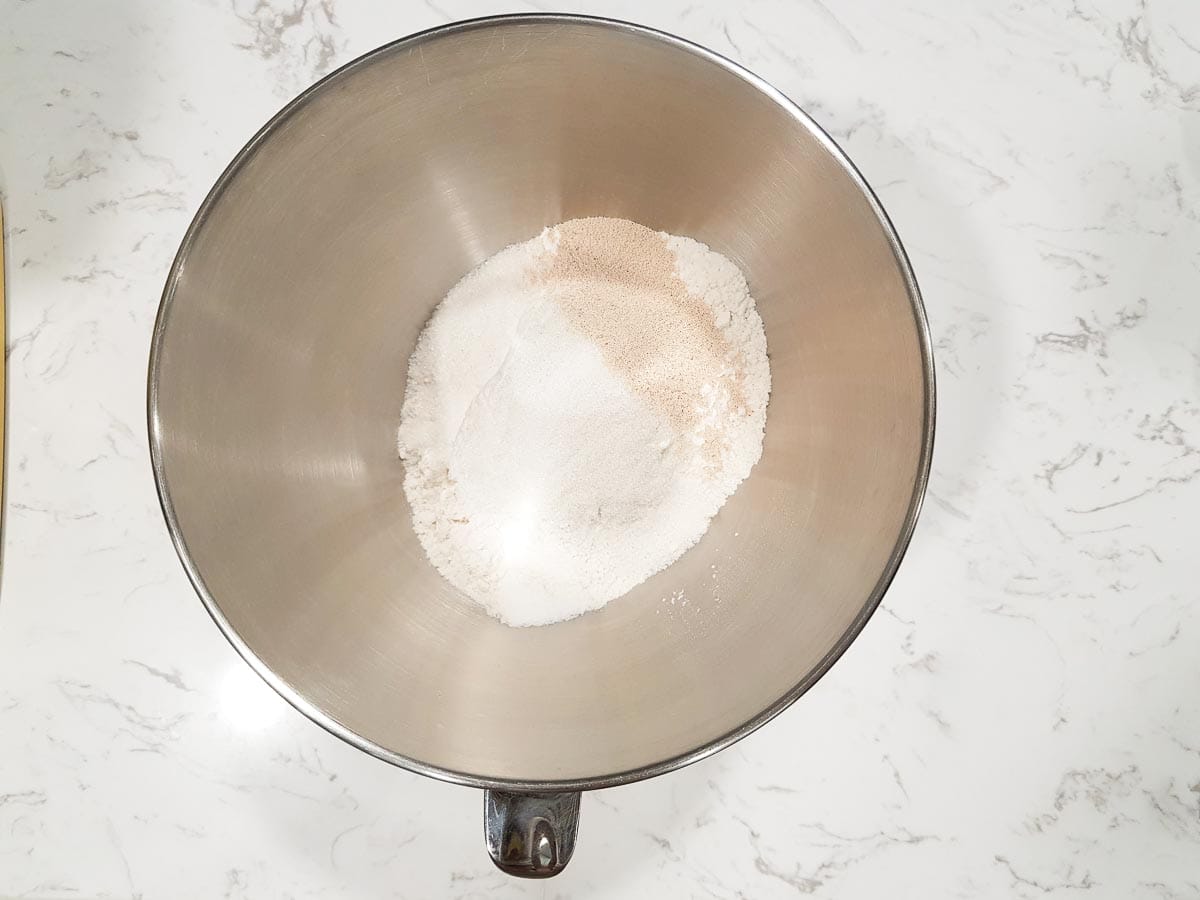 bread flour, yeast, and salt are put in a mixing bowl