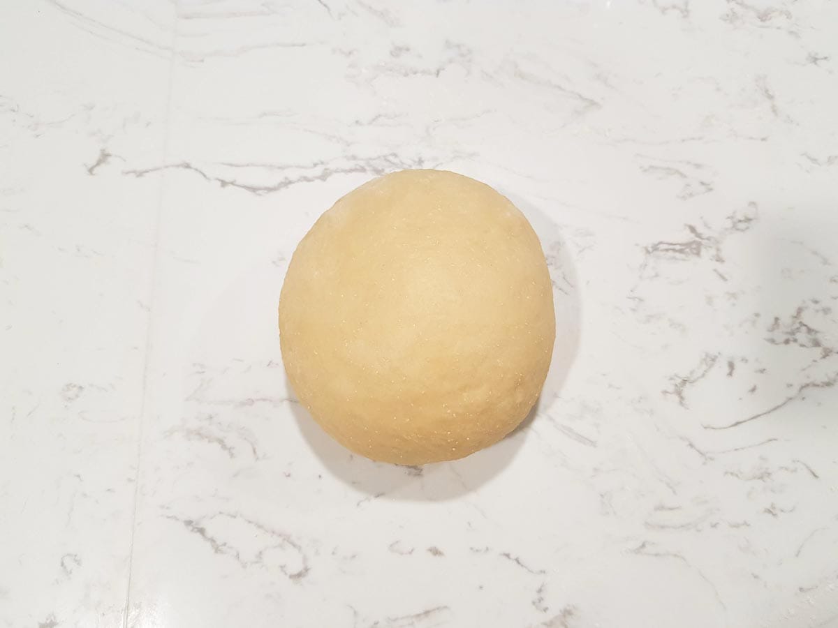 form the challah dough into a smooth, round ball seam side down