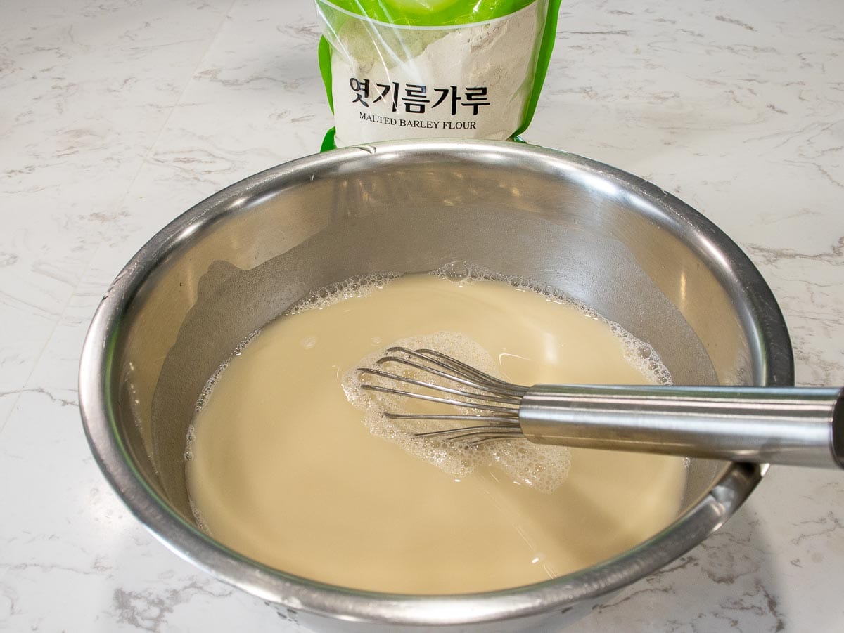 mix malted barley flour with water in a mixing bowl