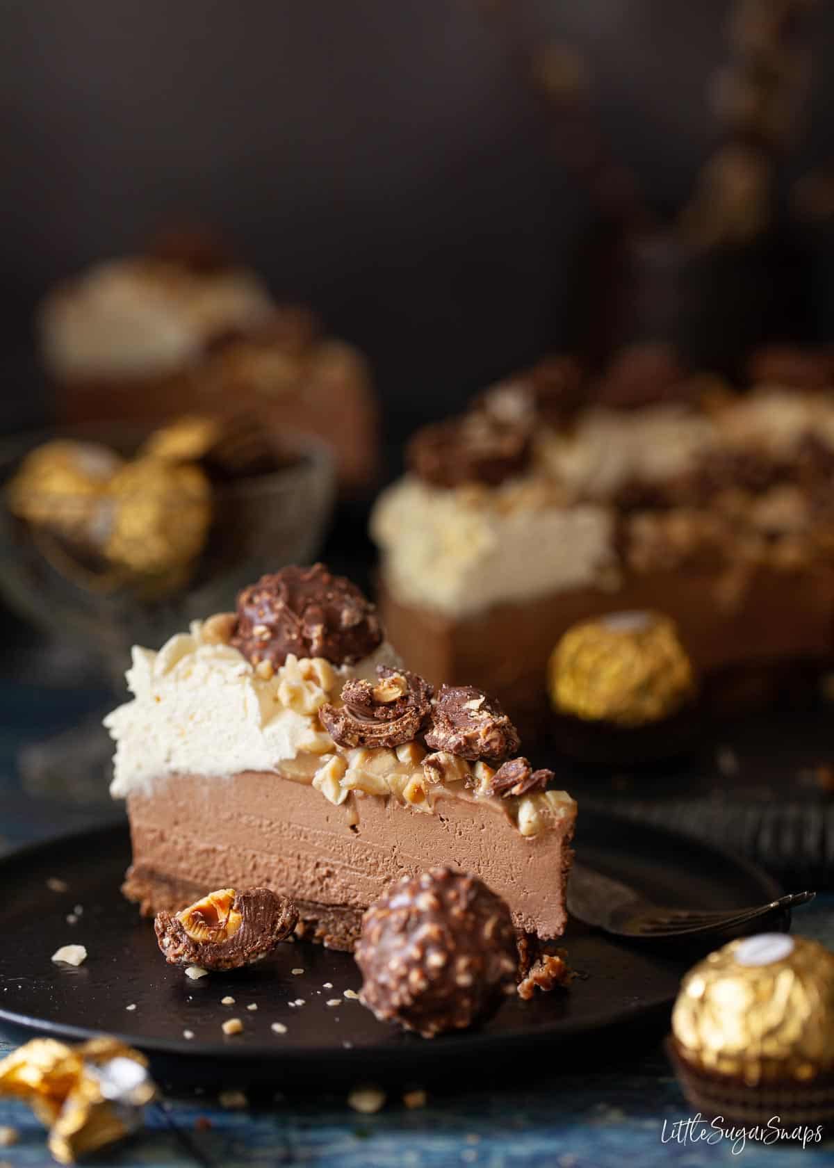 a slice of ferrero rocher cheesecake