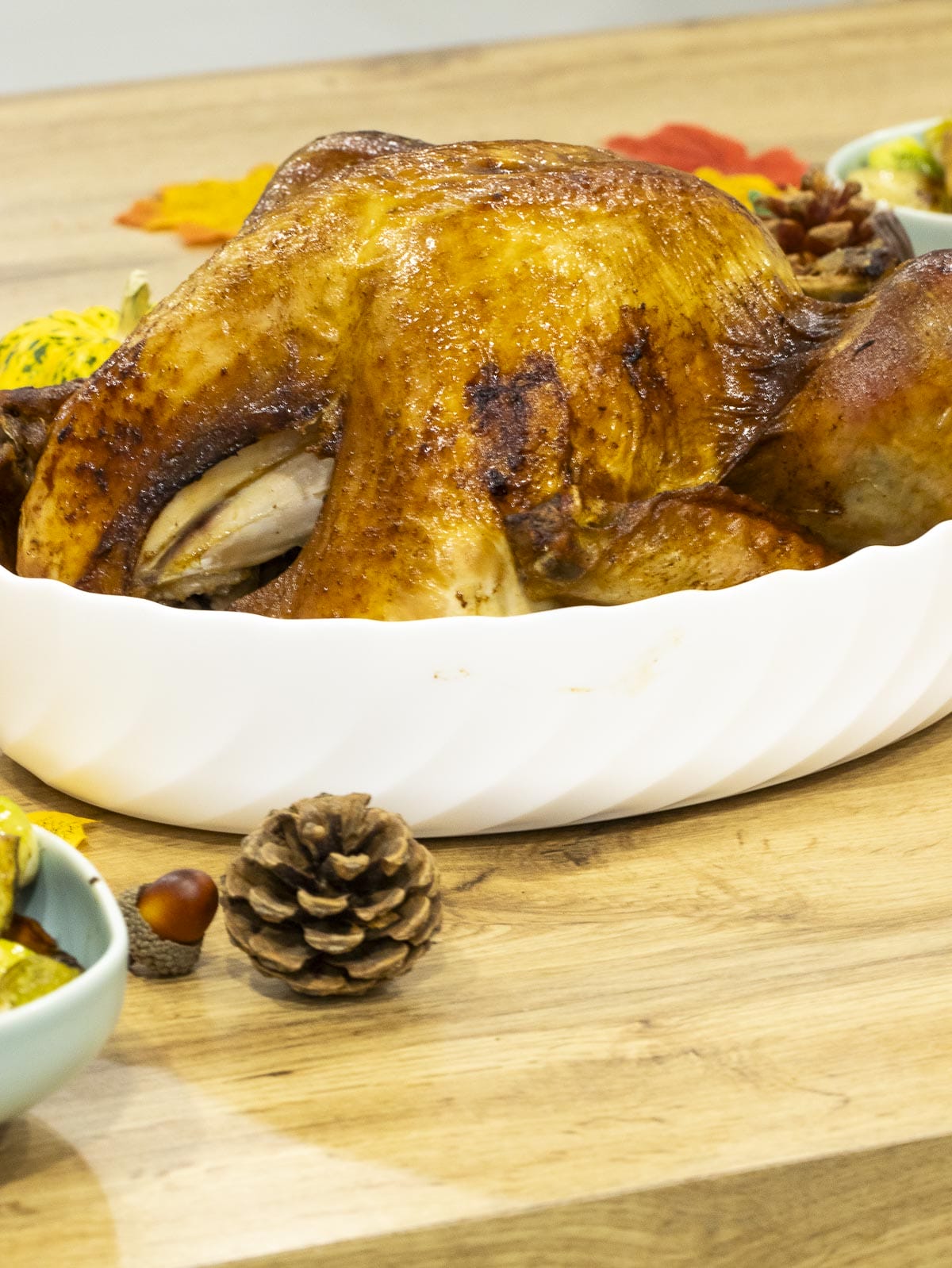 a roasted turkey using dry brine put in a white platter