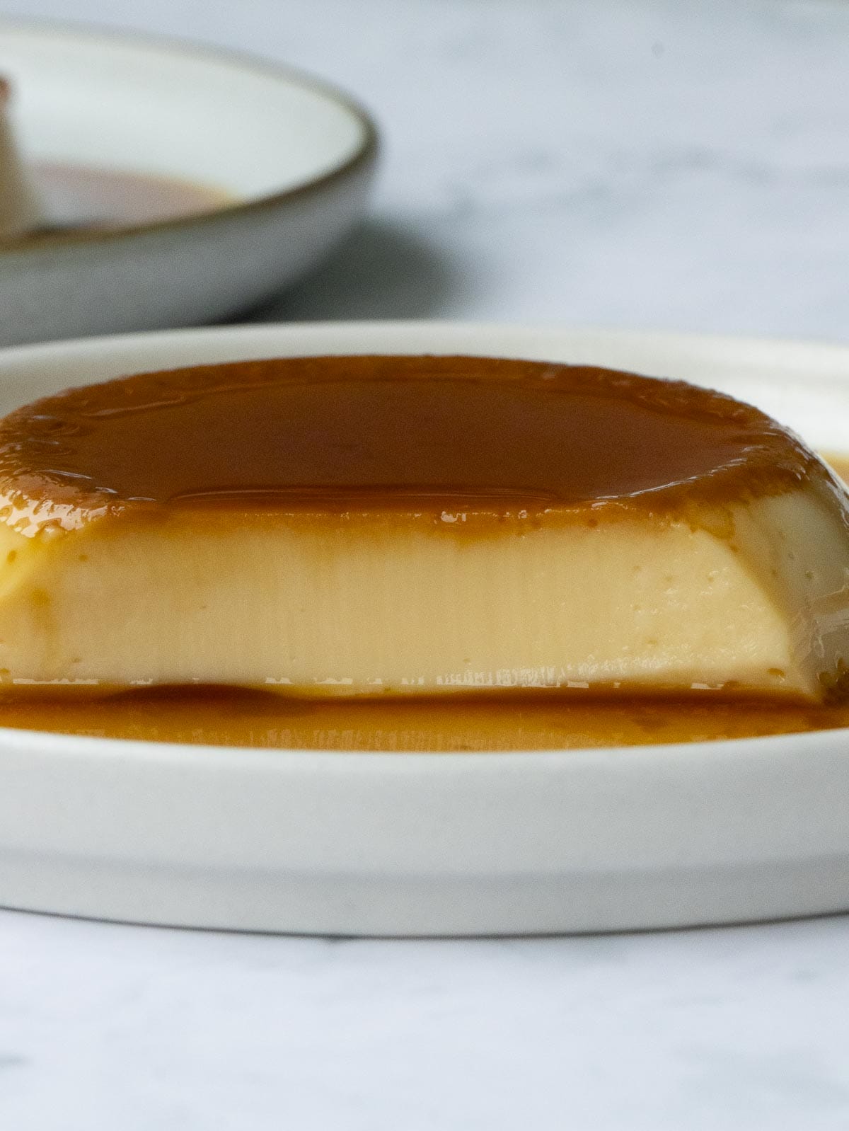 a half eaten caramelized flan