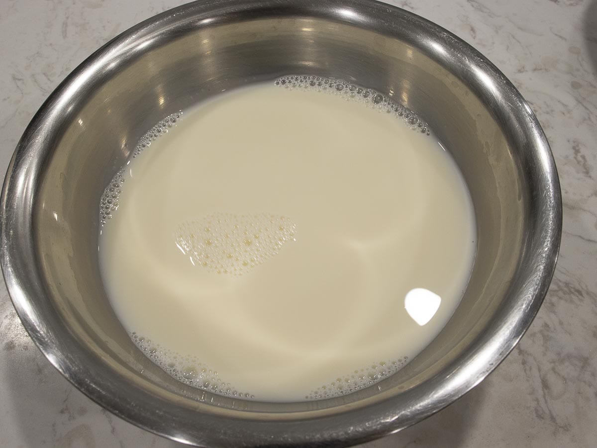 combine condensed milk and warm water in a mixing bowl