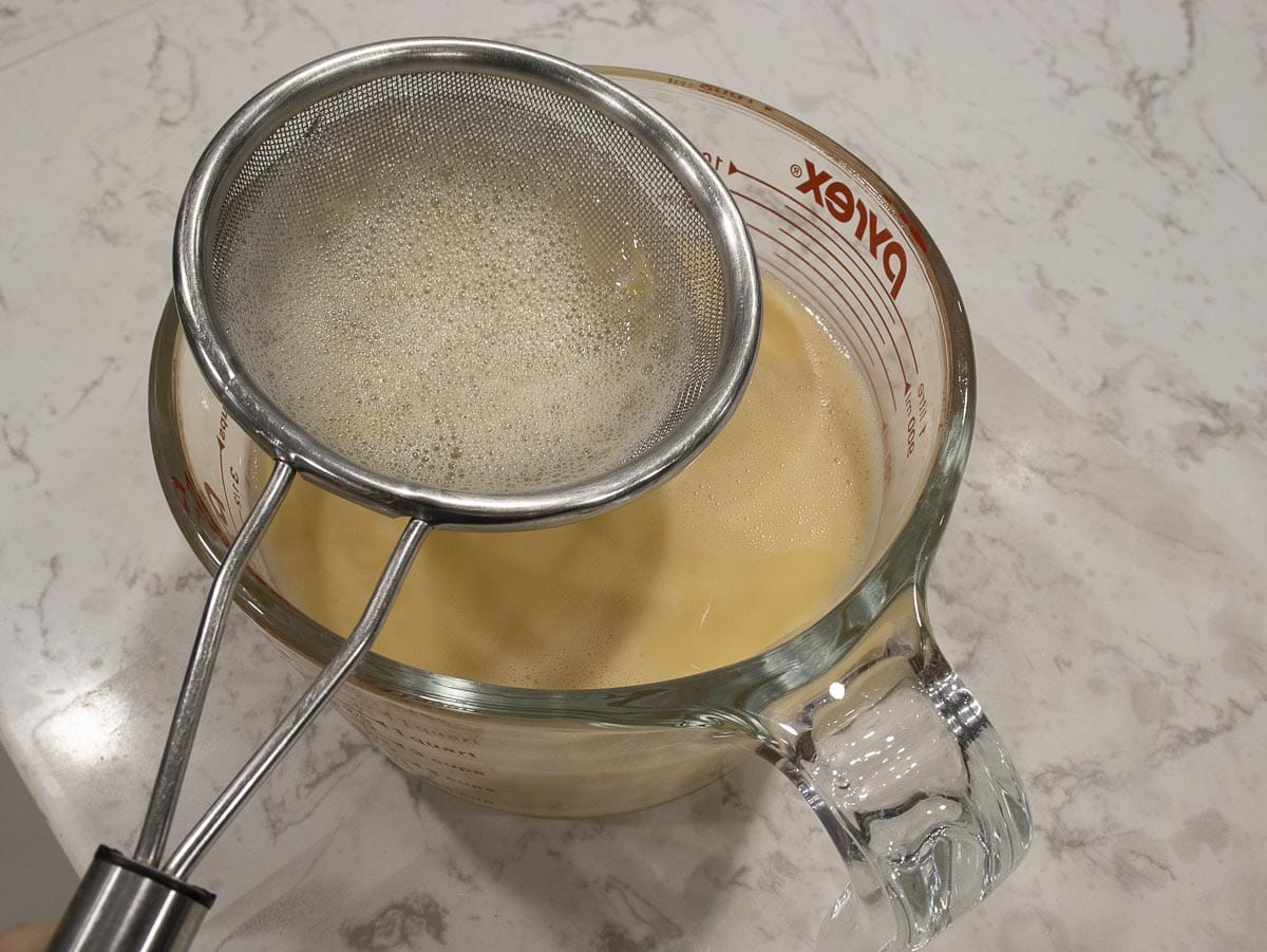 strain a flan mixture through a fine sieve