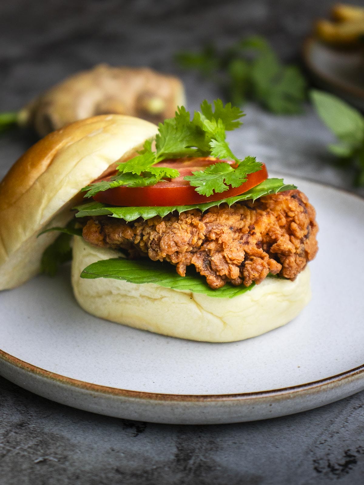 an open-faced crispy chicken pho burger