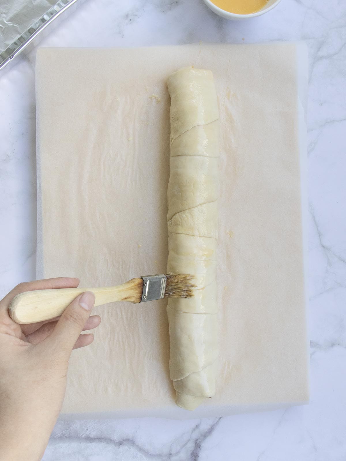 brush the pizza log with vegetable oil